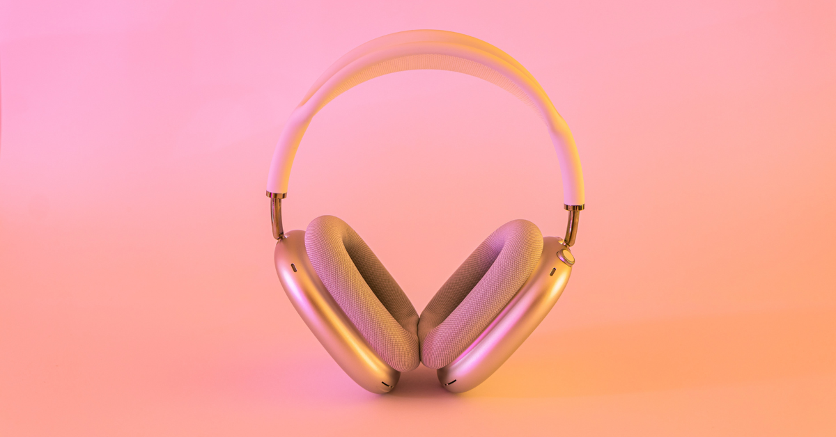 Headphones against a pink background