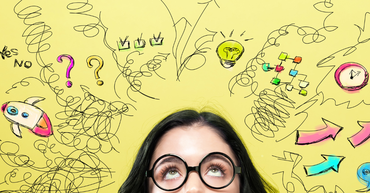 A person wearing round glasses looks up at a yellow background filled with colorful doodles symbolizing creativity and brainstorming.
